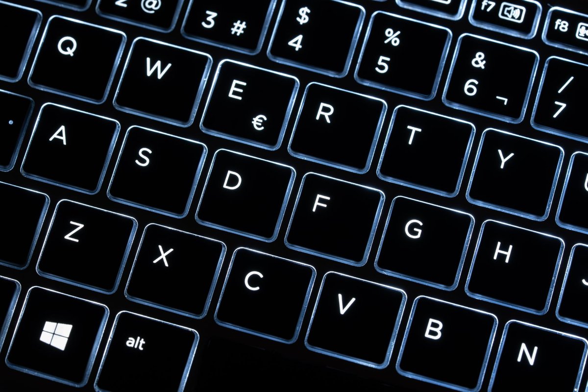 Backlit Windows laptop keyboard with the Windows key lit, representing a Copilot+ certified Windows 11 machine
