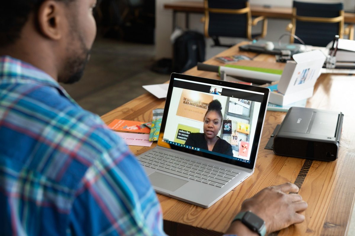 Man on a video call on a Windows laptop, the setting where Windows Studio Effects and live captions run on the NPU