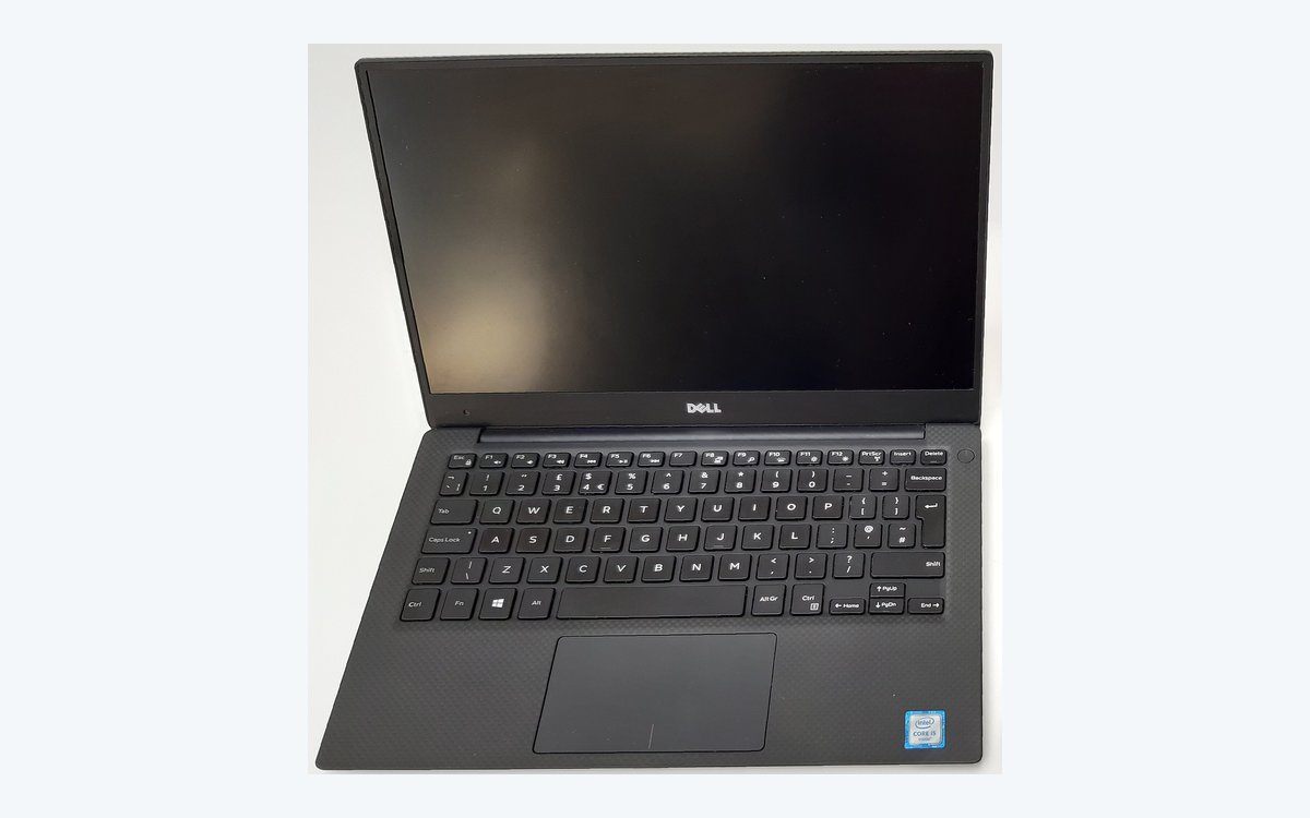 Dell XPS 13 premium Windows ultrabook open on a desk, a thin and light laptop for college students