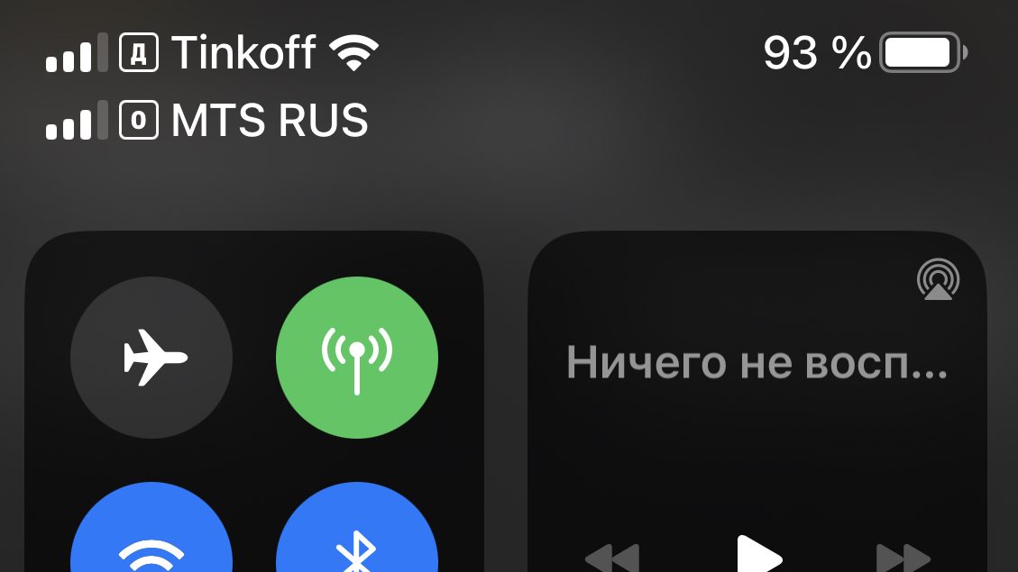 An iPhone status bar showing two active cellular lines from two different carriers at the same time, each with its own signal bars, an example of dual-SIM running two numbers on one phone