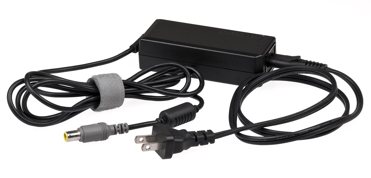 A black laptop AC adapter power brick with a barrel charging connector and attached cable