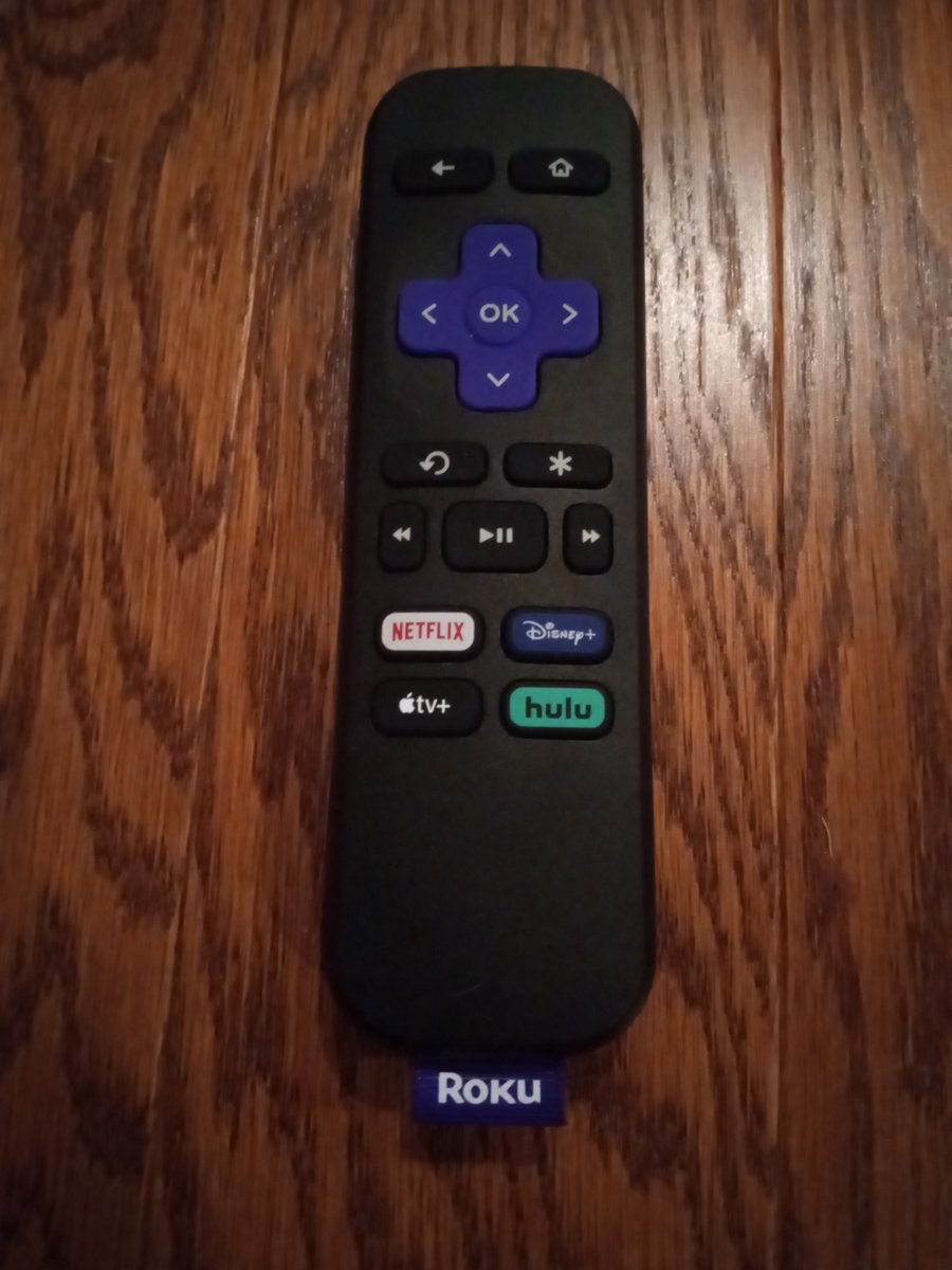 Roku voice remote with its purple directional pad and app shortcut buttons for Netflix, Disney Plus, Apple TV, and Hulu
