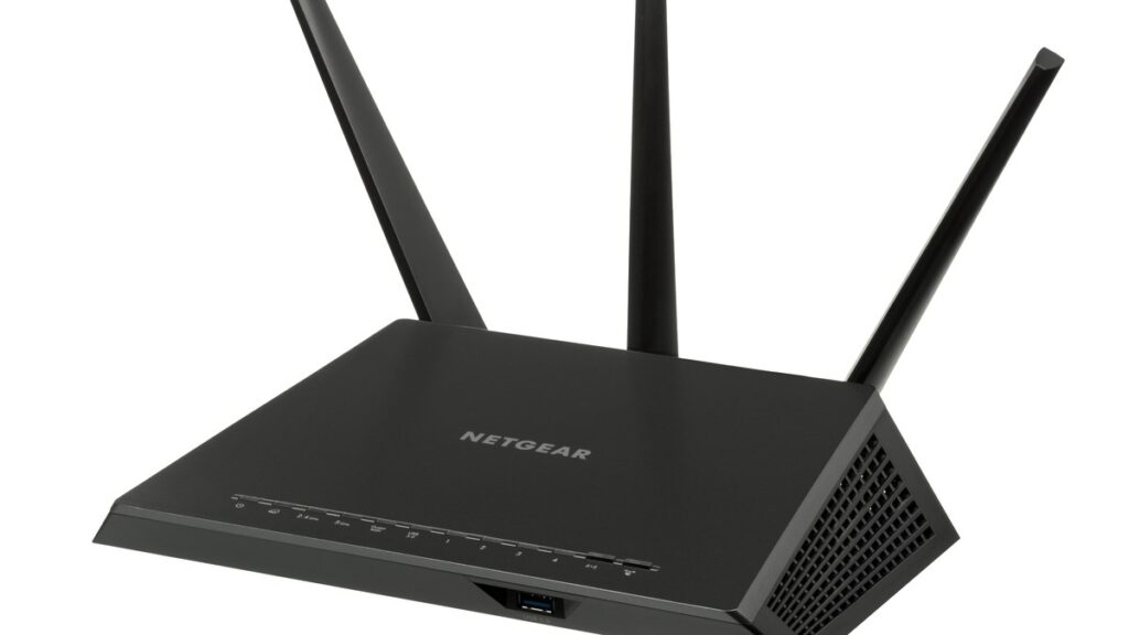 A black Netgear Nighthawk home WiFi router with three antennas on a white background, the kind of router whose password you change from its admin page